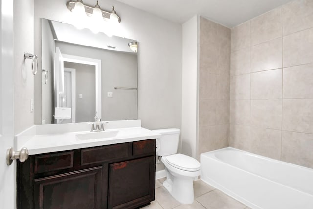 full bathroom featuring tile patterned floors, vanity, toilet, and tiled shower / bath