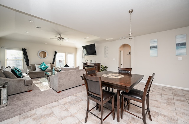 dining space featuring ceiling fan