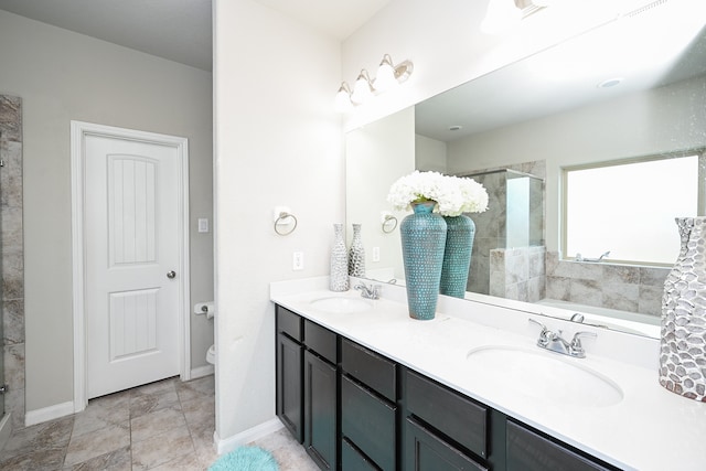 full bathroom featuring separate shower and tub, vanity, and toilet