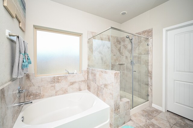 bathroom with independent shower and bath