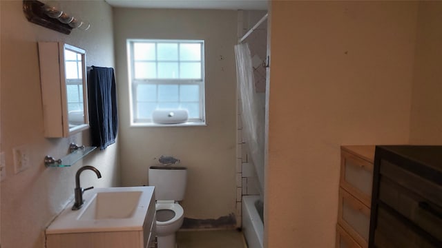 full bathroom featuring shower / tub combo, vanity, and toilet