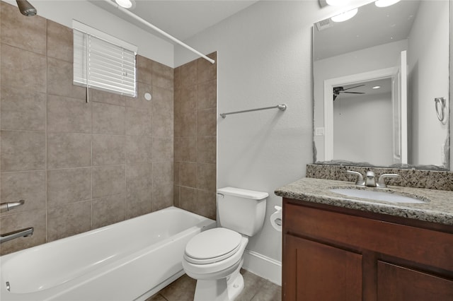 full bathroom featuring ceiling fan, toilet, vanity, and tiled shower / bath