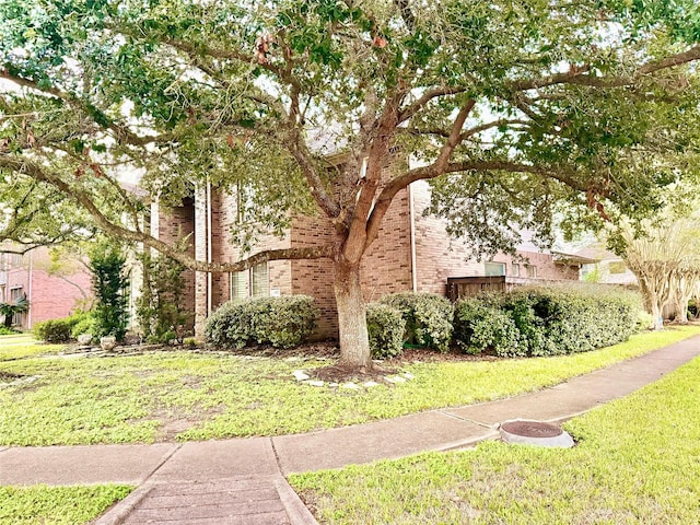 view of property exterior with a lawn