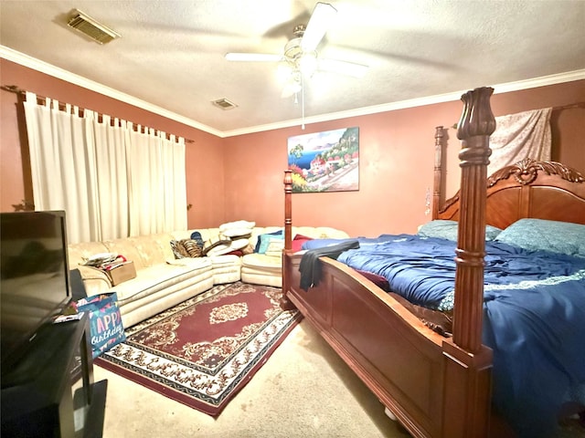 bedroom featuring carpet flooring, ceiling fan, and a textured ceiling