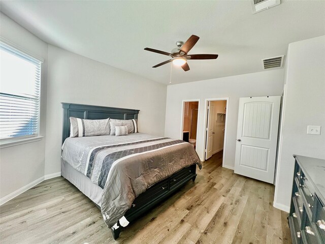 bedroom with light hardwood / wood-style flooring and ceiling fan