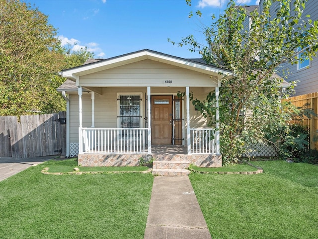 4808 Mcewen St, Houston, TX 77009 - shotgun-style home featuring a porch
