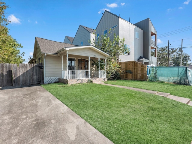 4808 Mcewen St, Houston, TX 77009 - view of front of home with covered porch and a shingled roof