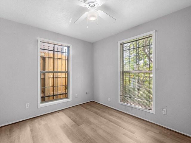 4808 Mcewen St, Houston, TX 77009 - empty room with wood finished floors and a ceiling fan