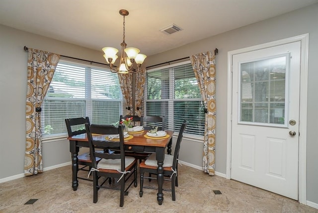 dining area featuring a chandelier