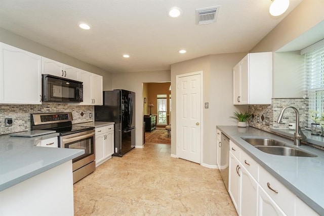 kitchen with white cabinets, sink, tasteful backsplash, and black appliances