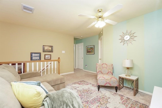 carpeted living room featuring ceiling fan