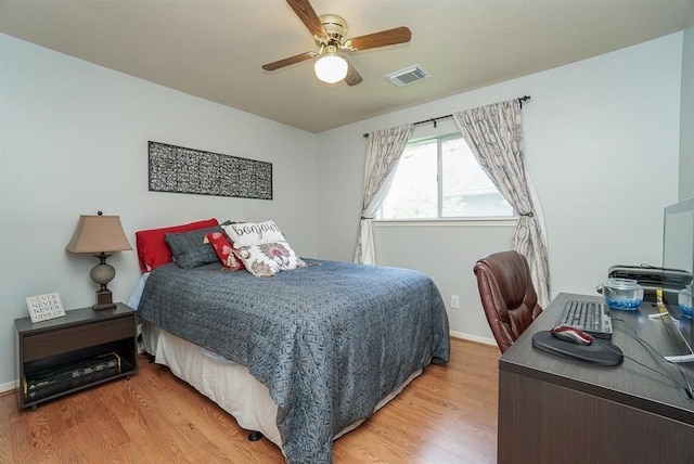 bedroom featuring hardwood / wood-style flooring and ceiling fan