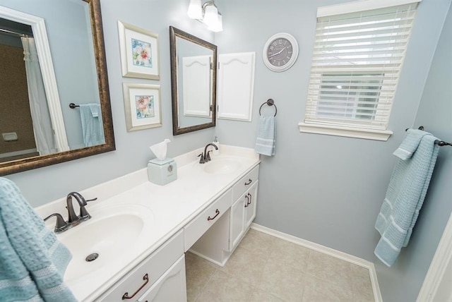 bathroom with tile patterned flooring and vanity