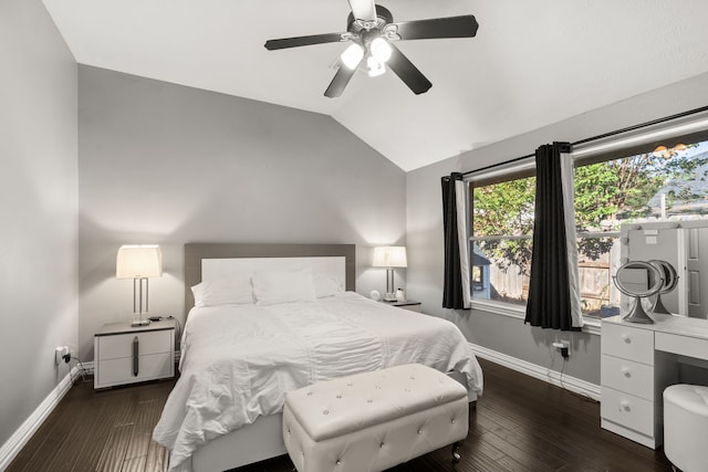 bedroom featuring ceiling fan, dark wood-type flooring, and vaulted ceiling