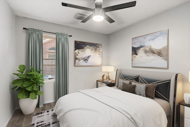 bedroom featuring hardwood / wood-style floors and ceiling fan