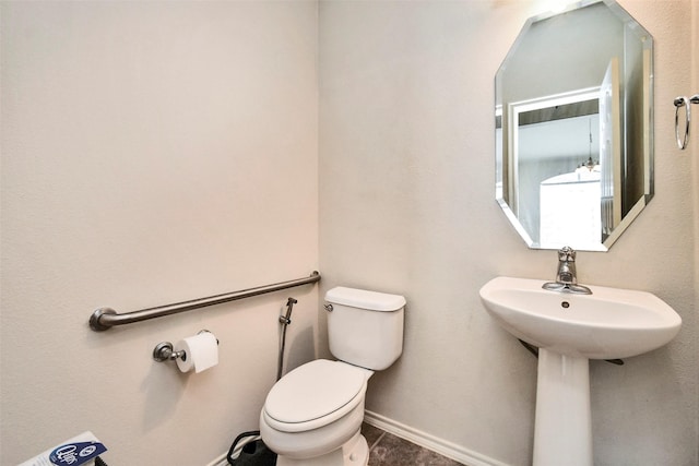 bathroom with sink and toilet