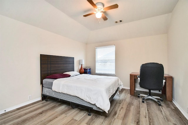 bedroom with wood-type flooring, lofted ceiling, and ceiling fan