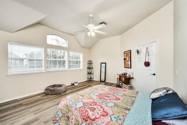 bedroom featuring lofted ceiling, hardwood / wood-style flooring, and ceiling fan