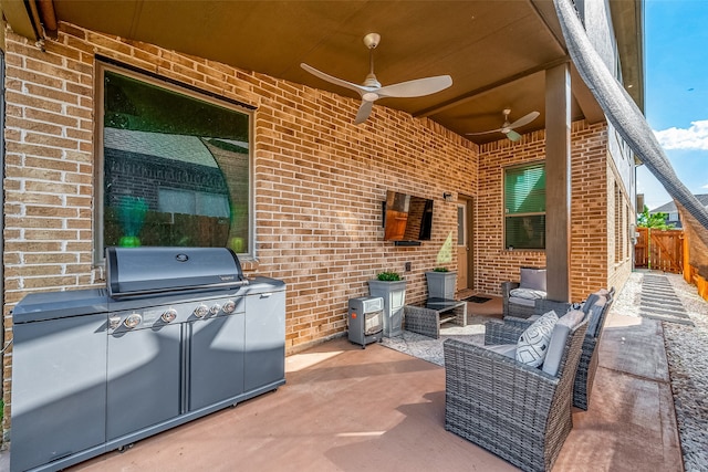 view of patio with outdoor lounge area, ceiling fan, and area for grilling