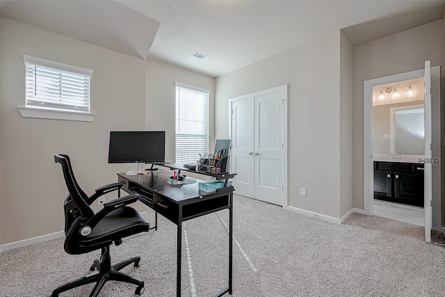 office space with light colored carpet