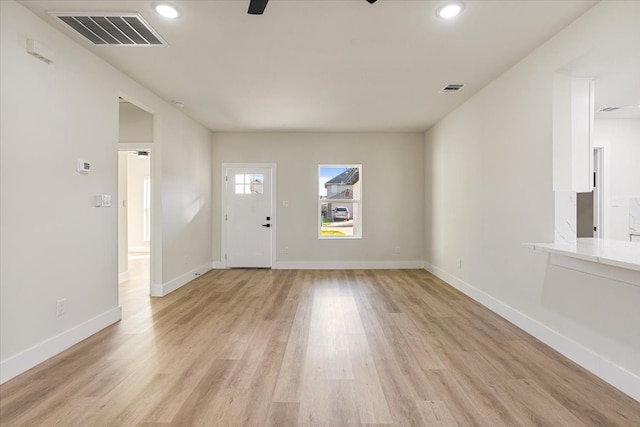 unfurnished living room featuring light hardwood / wood-style flooring