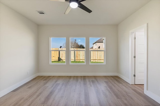 empty room featuring ceiling fan and light hardwood / wood-style floors