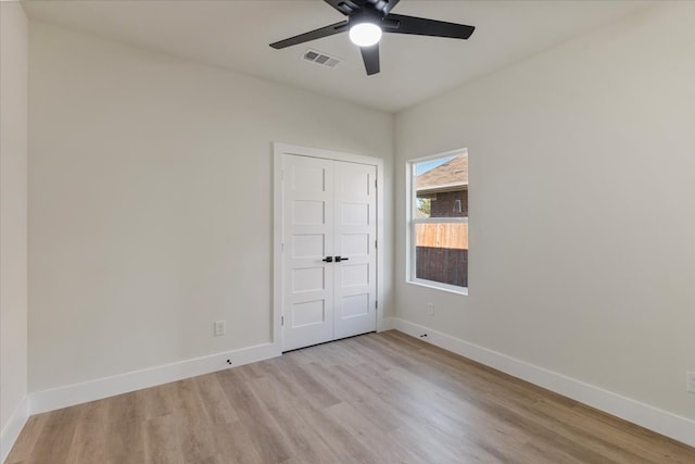 spare room with ceiling fan and light hardwood / wood-style floors