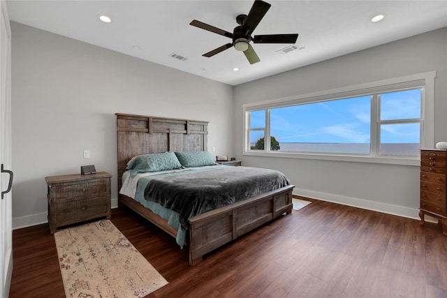 bedroom with ceiling fan and dark wood-type flooring