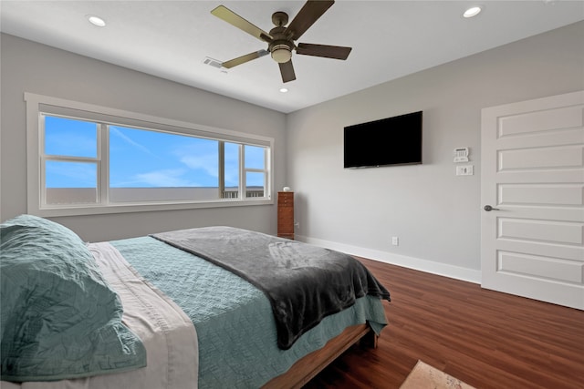 bedroom featuring ceiling fan and dark wood-type flooring