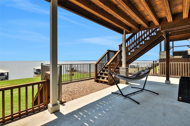 view of patio featuring a water view