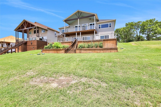 rear view of property with a lawn