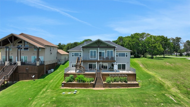 rear view of house with a yard