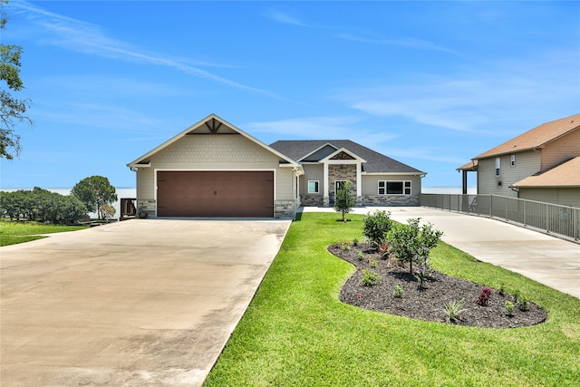 view of front facade with a front yard and a garage