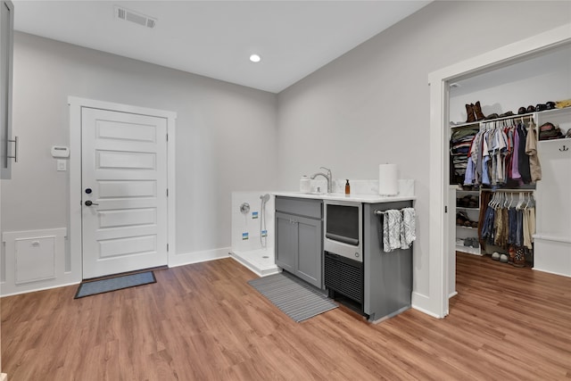 washroom featuring light hardwood / wood-style floors