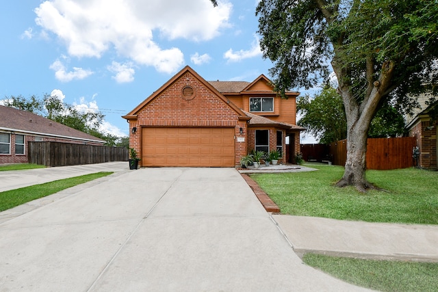 view of front facade with a garage and a front lawn