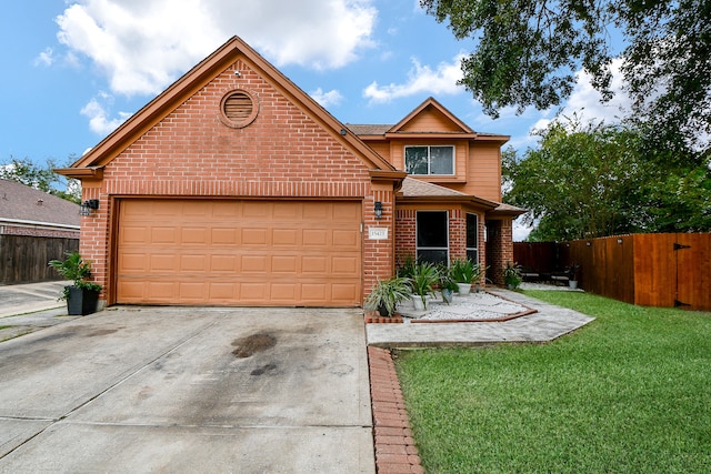 view of front of house with a front lawn and a garage