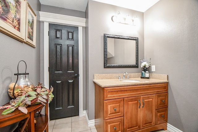 bathroom with tile patterned floors and vanity