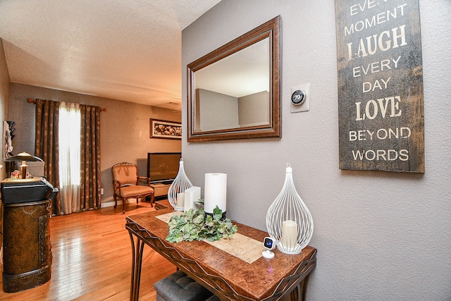 office area featuring a textured ceiling and hardwood / wood-style flooring