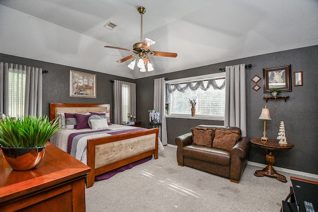 carpeted bedroom featuring ceiling fan and lofted ceiling