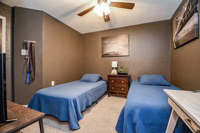 bedroom featuring light carpet, a textured ceiling, ceiling fan, and lofted ceiling