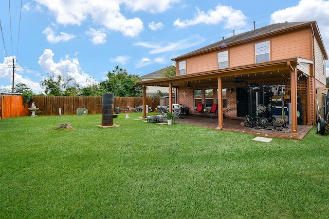 view of yard featuring ceiling fan and a patio area