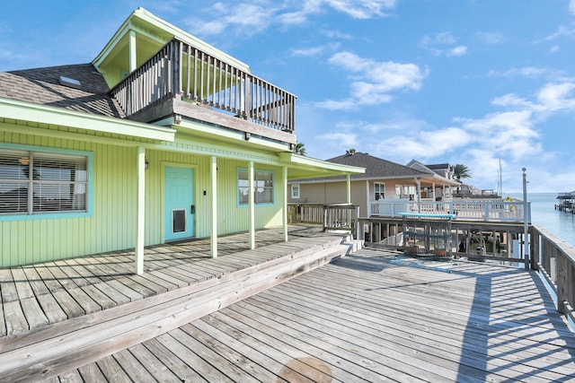 wooden terrace with a water view