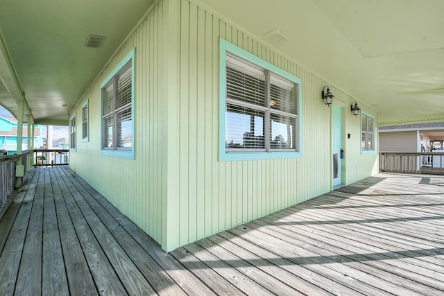 wooden terrace with a porch