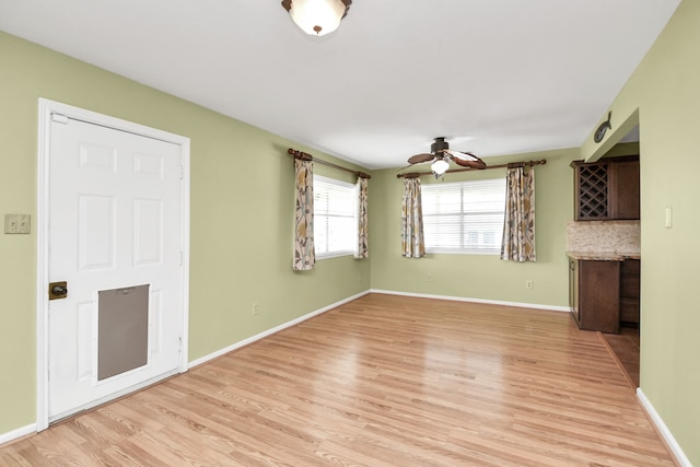 interior space featuring light wood-type flooring and ceiling fan