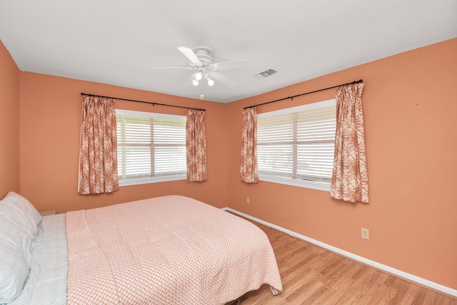 bedroom featuring ceiling fan and light hardwood / wood-style flooring