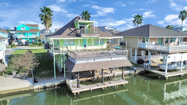 view of dock with a deck with water view