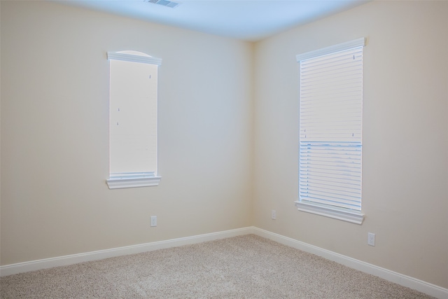 unfurnished room featuring carpet flooring