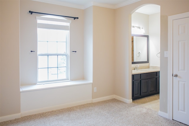 bathroom with vanity and ornamental molding