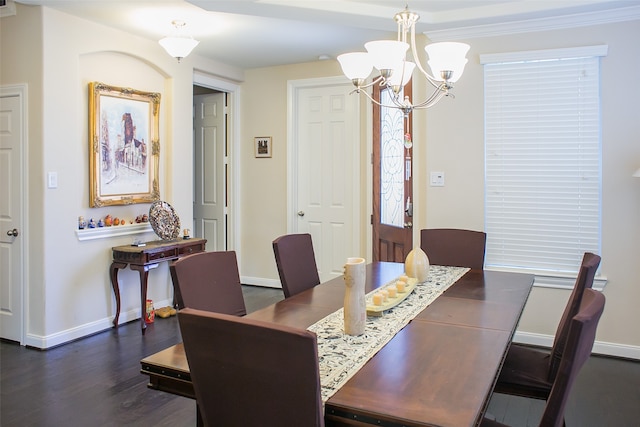 dining area featuring ornamental molding, dark wood-type flooring, and a notable chandelier