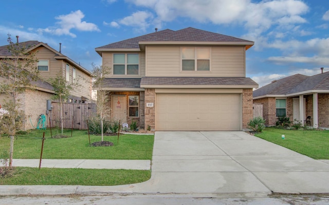 view of front facade featuring a garage and a front lawn